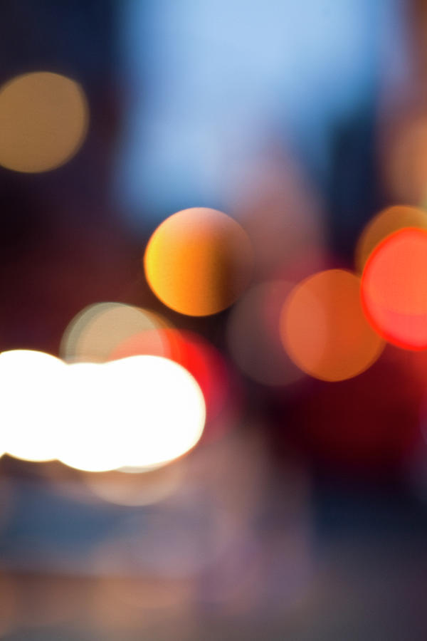 Defocused View Of City Lights At Night Photograph by Johner Images