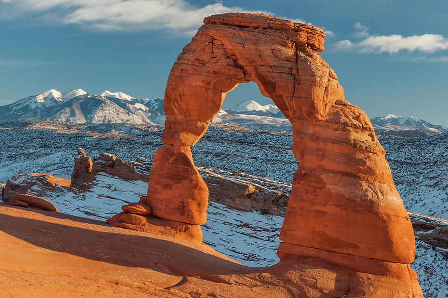 Delicate Arch And La Sal Mts Photograph by Jeff Foott