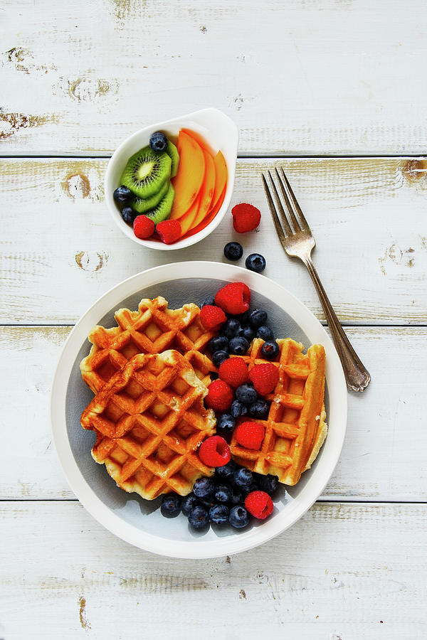 Delicious Breakfast Set. Warm Homemade Traditional Belgian Waffles With Fresh Berry And Fruit On White Rustic Wooden Background Photograph by Yuliya Gontar