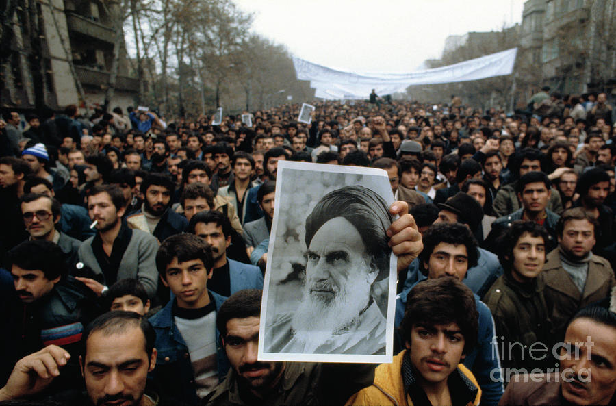 Demonstrators Carrying Photo Of Photograph by Bettmann