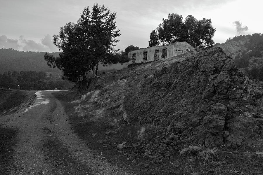 Derelict house on the hill in monochrome Photograph by Iordanis Pallikaras