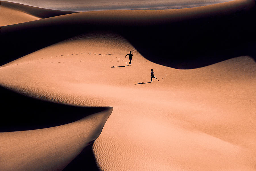 Desert Runners Photograph by Mohammad Fotouhi
