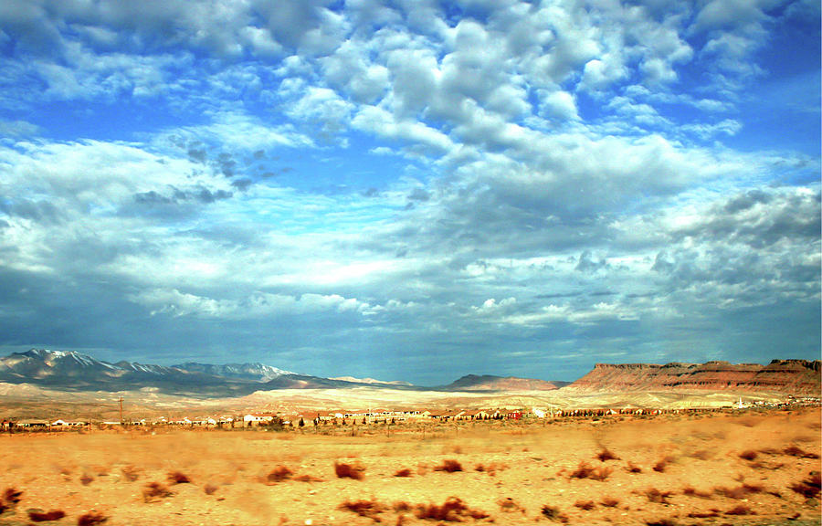 Desert With Clouds In A Deep Blue Sky Photograph by Raquel Lonas