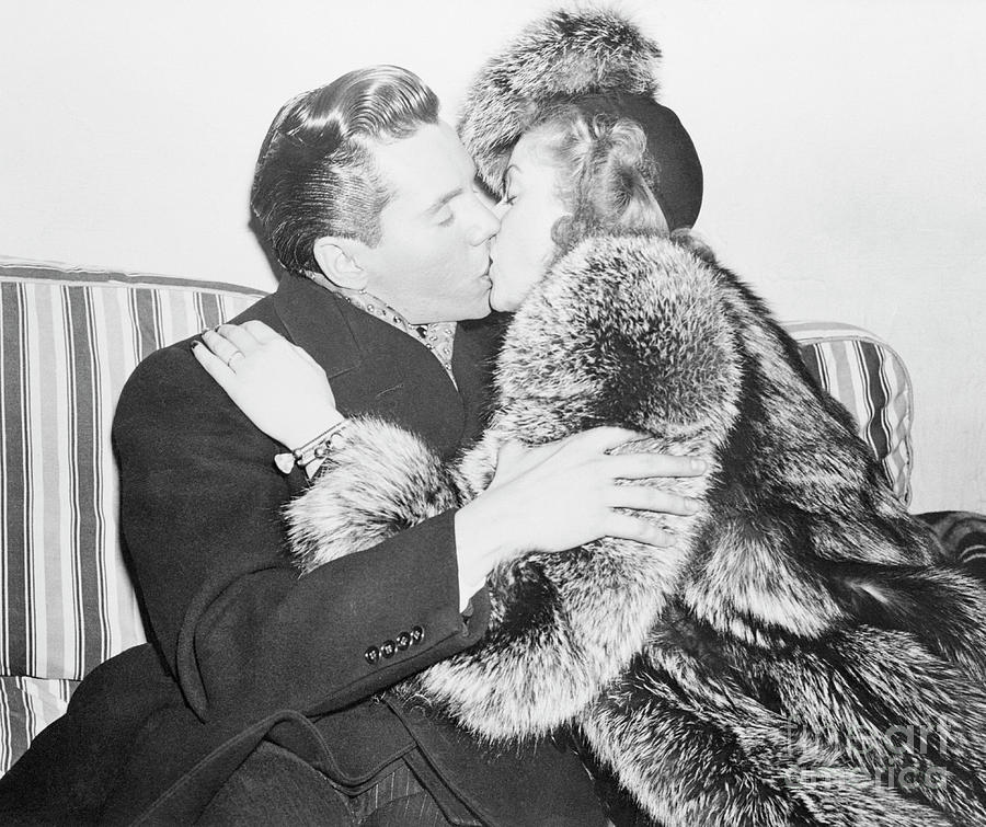 Desi Arnaz Kissing His New Wife Lucille Photograph by Bettmann