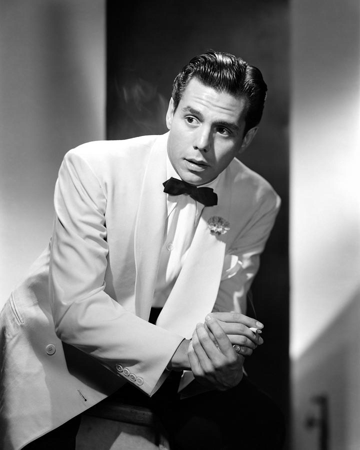 Desi Arnaz Standing With Cigarette While Looking Away Photograph by ...