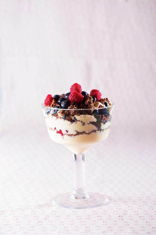 Dessert With Berries And Chocolate Biscuit Crumbs Photograph by Nicolas Lemonnier