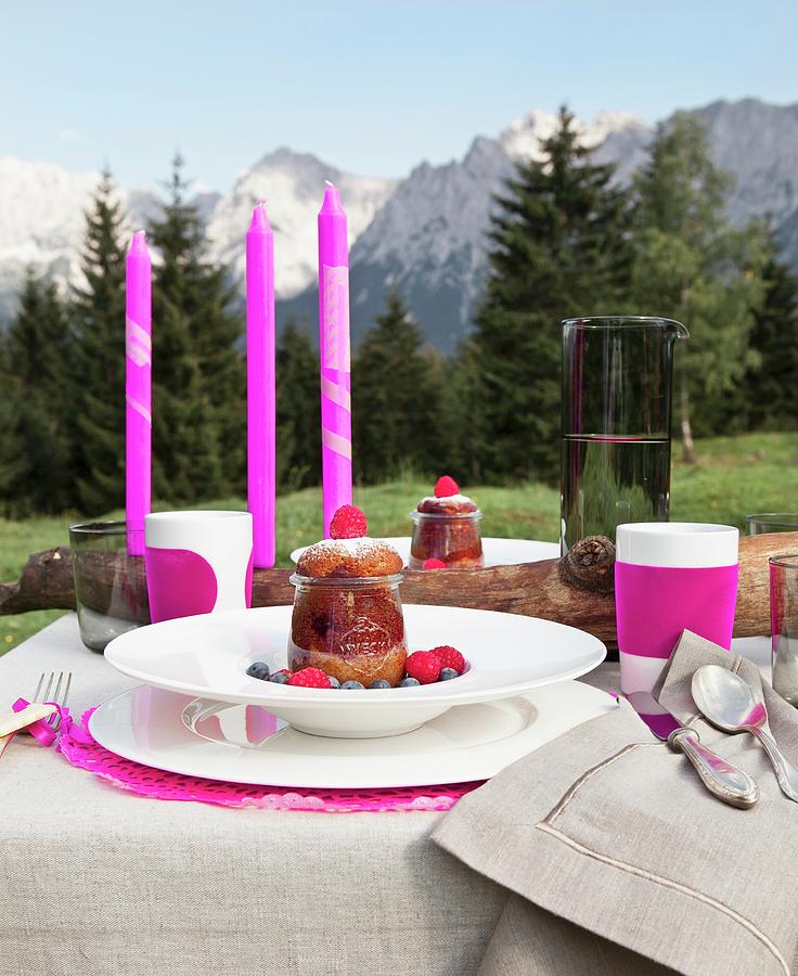 Desserts And Pink Candles On Festively Set Table In Alpine Landscape Photograph by Nikky Maier