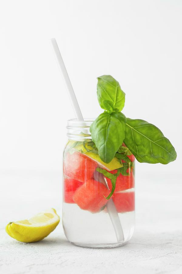 Detox Water With Melon, Lemon And Basil Photograph by Jan Wischnewski