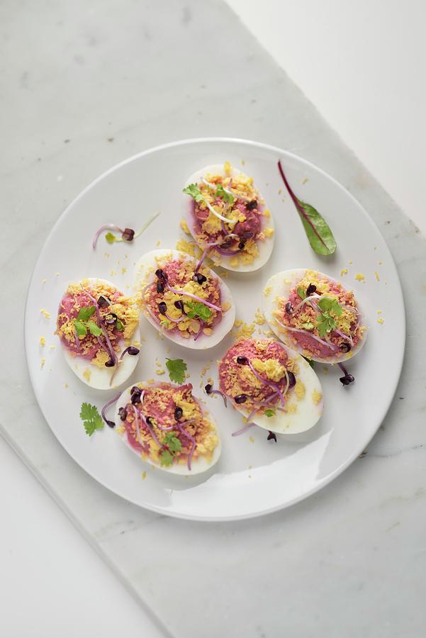 Deviled Eggs With Beetroot Filling Photograph by Laurange