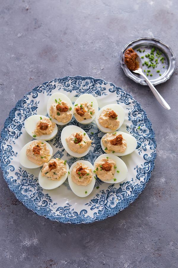Devilled Eggs With Red Pesto On A Vintage Plate Photograph by Aniko Takacs