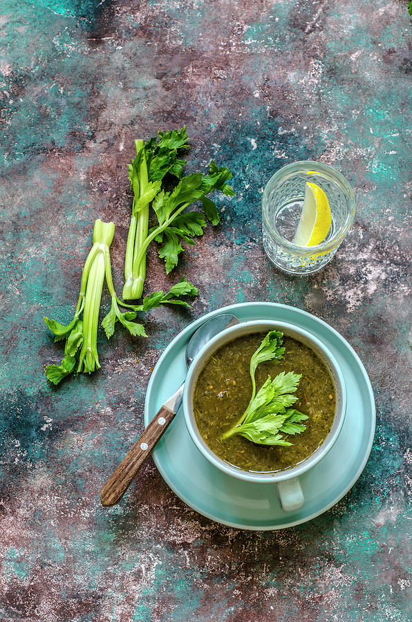 Dietary Soup Of Celery, Fresh Celery Stalk And A Glass Of Water And A Slice Of Lemon Photograph by Gorobina
