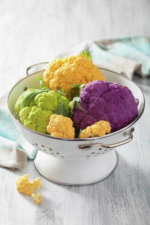 Different Coloured Cauliflower In A Colander Photograph by Olga Miltsova