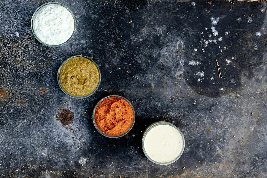 Different Dips. From Left To Right:yoghurt-cucumber Sauce, Kik-bean-yoghurt Sauce, Romesco-sauce And Remoulade-sauce Photograph by Comida Communication