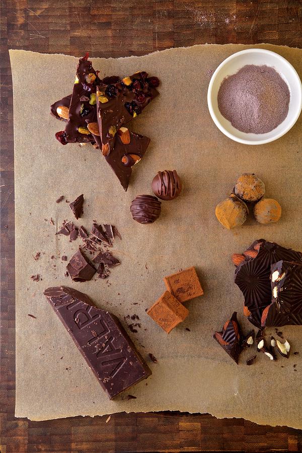 Different Kind Of Chocolate:powder Chocolate, Chocolate Truffles, Valrona Chocolate Bar And Chocolate Bar With Almonds Photograph by Andre Baranowski