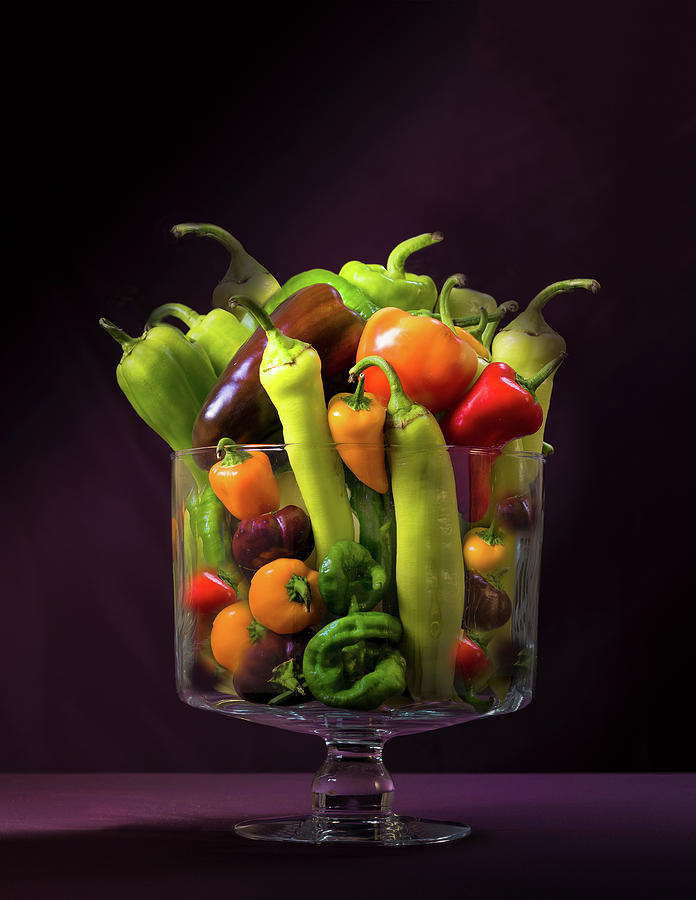 Different Types Of Peppers In A Glass Jar Against A Dark Background Photograph by Judy Doherty