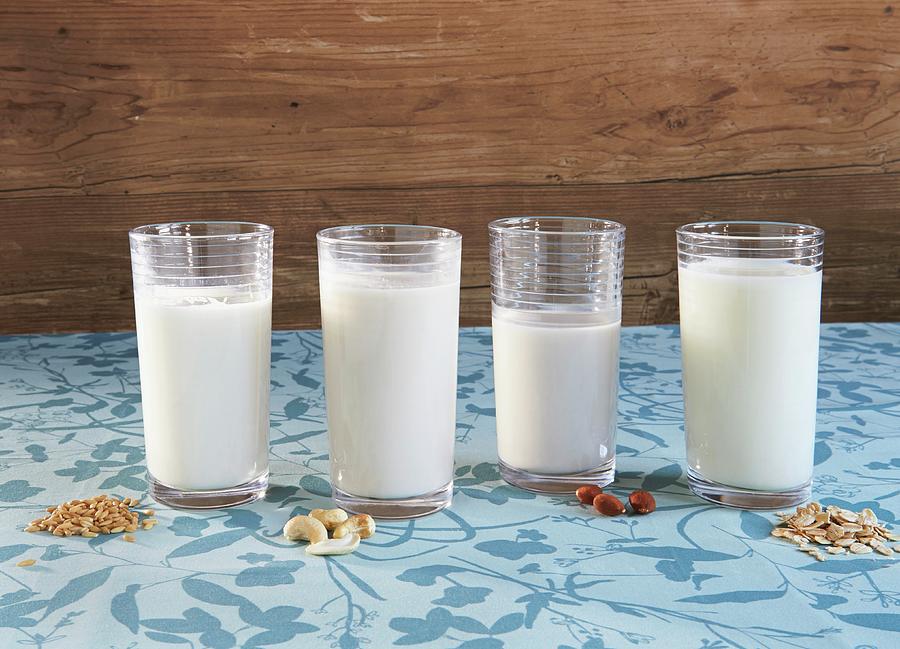 Different Types Of Vegan Milk: Grain Milk, Cashew Milk, Almond Milk And Oat Milk Photograph by Allison Dinner