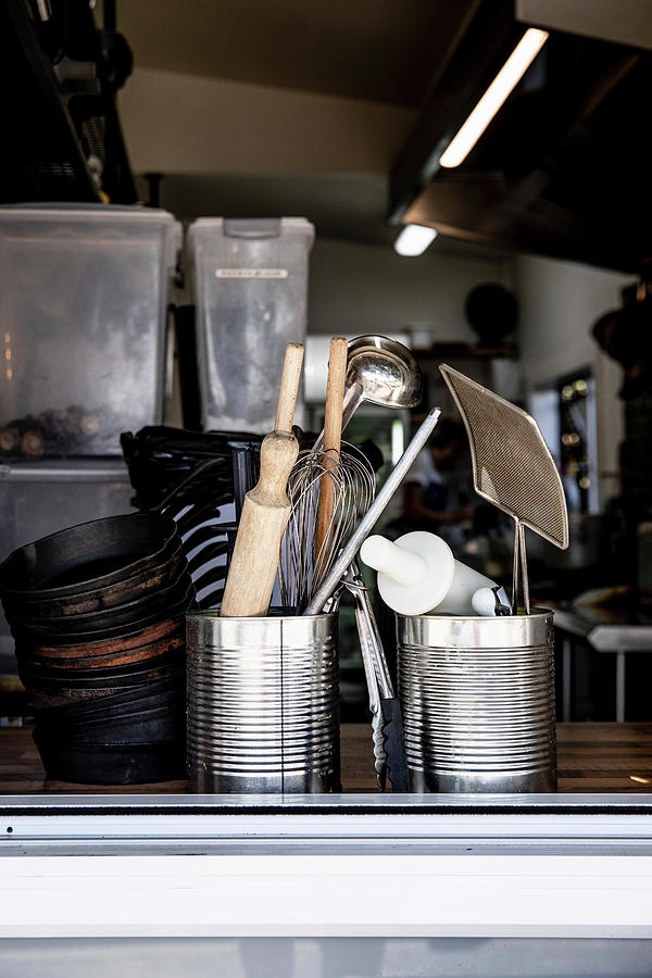 Different Utensils In A Restaurant Kitchen Photograph by Claudia Timmann