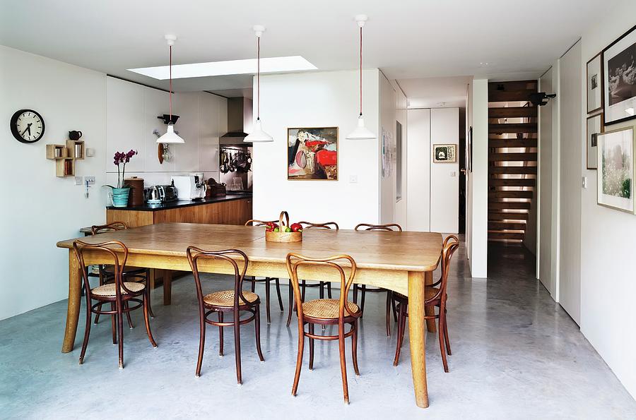 Dining Room With Concrete Floor, Long Dining Room And Wooden Chairs With Curved Backs Photograph by Simon Maxwell Photography