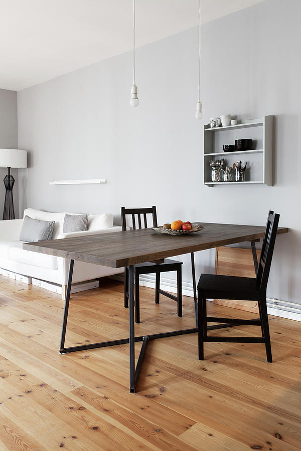 Dining Table With Dark Wooden Top And Black Chairs In Open-plan Interior Photograph by Hej.hem Interior