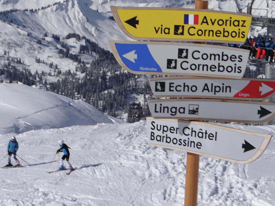 Directional signpost and ski lift Photograph by Steve Estvanik