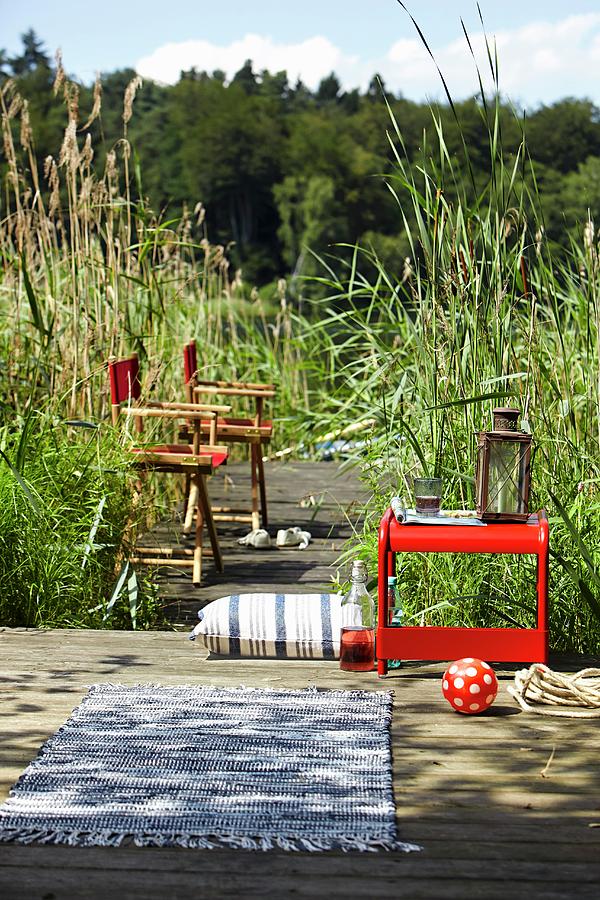 Directors Chairs & Small Table On Boardwalk Amongst Reeds Photograph by Jalag / Olaf Szczepaniak