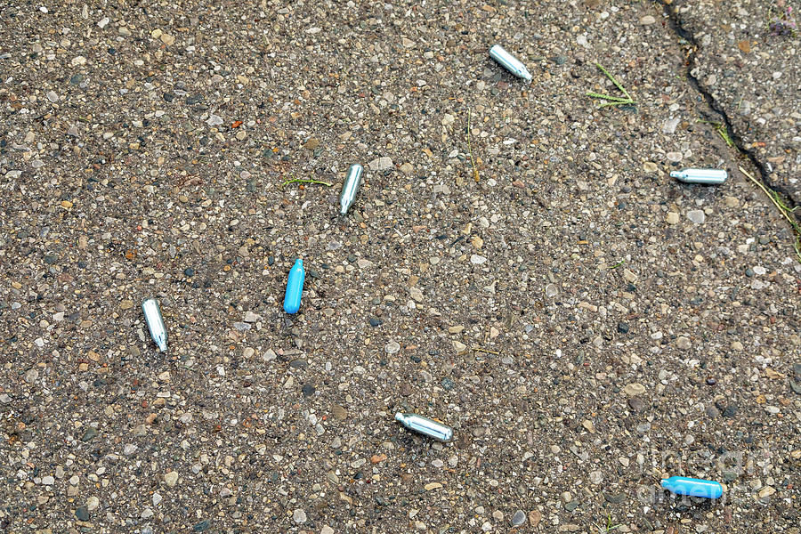 Discarded Laughing Gas Capsules Photograph by Jim West/science Photo ...