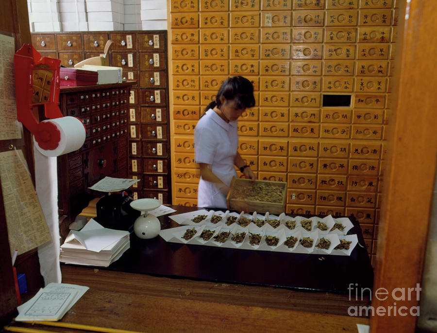 Dispensing Chinese Herbal Medicine At A Pharmacy Photograph by Mark De Fraeye/science Photo Library