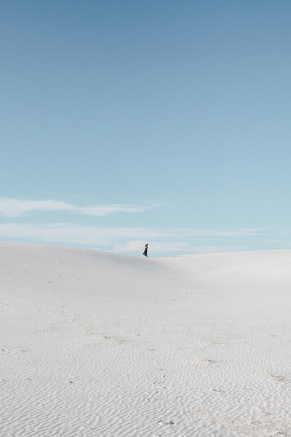 White Sands National Monument Photograph - Distant View Of Woman Standing On Field Against Sky At White Sands National Monument by Cavan Images