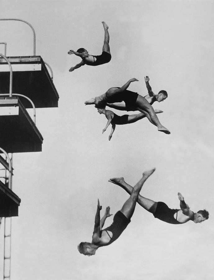 Divers Group Diving Artistically Photograph by Keystone-france