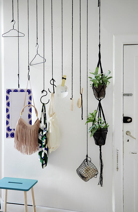 Diy Coat Rack Made From Black Ropes And Butchers Hooks Against White Wall Photograph by Nicoline Olsen
