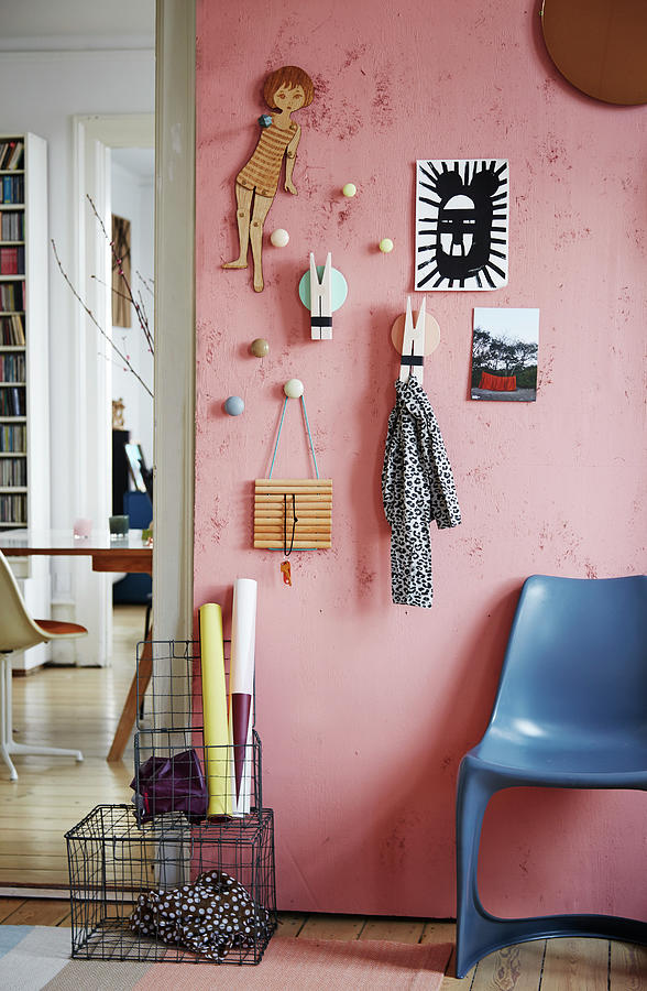 Diy Coat Rack Made From Coat Hooks And Oversized Clothes Pegs On Pink Wall Photograph by Nicoline Olsen