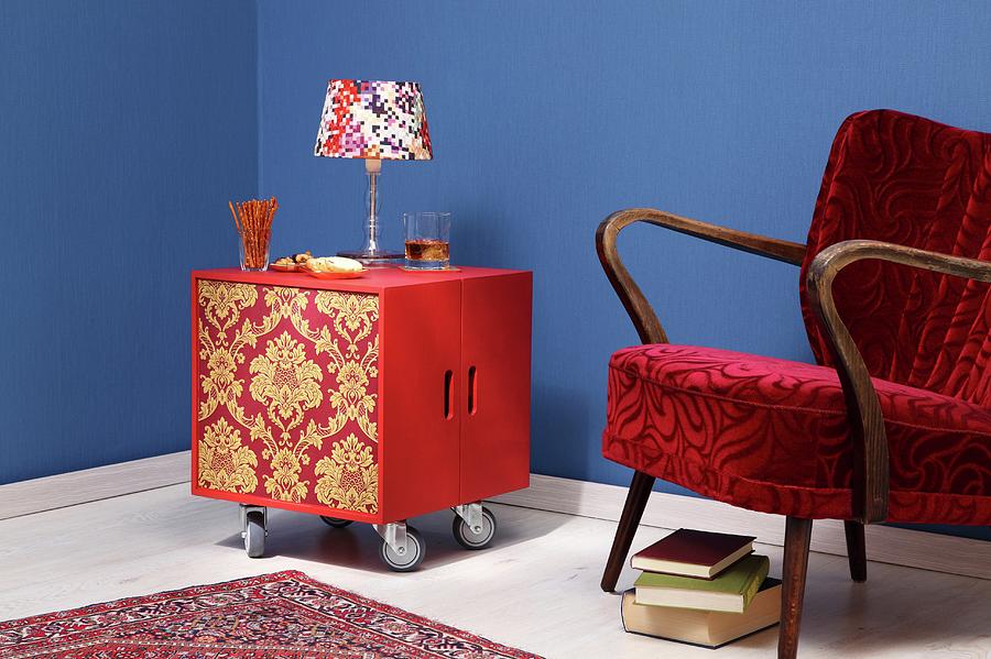 Diy Minibar Made From Two Wooden Crates Covered In Wallpaper On Castors Next To 50s Armchair Photograph by Thordis Rggeberg
