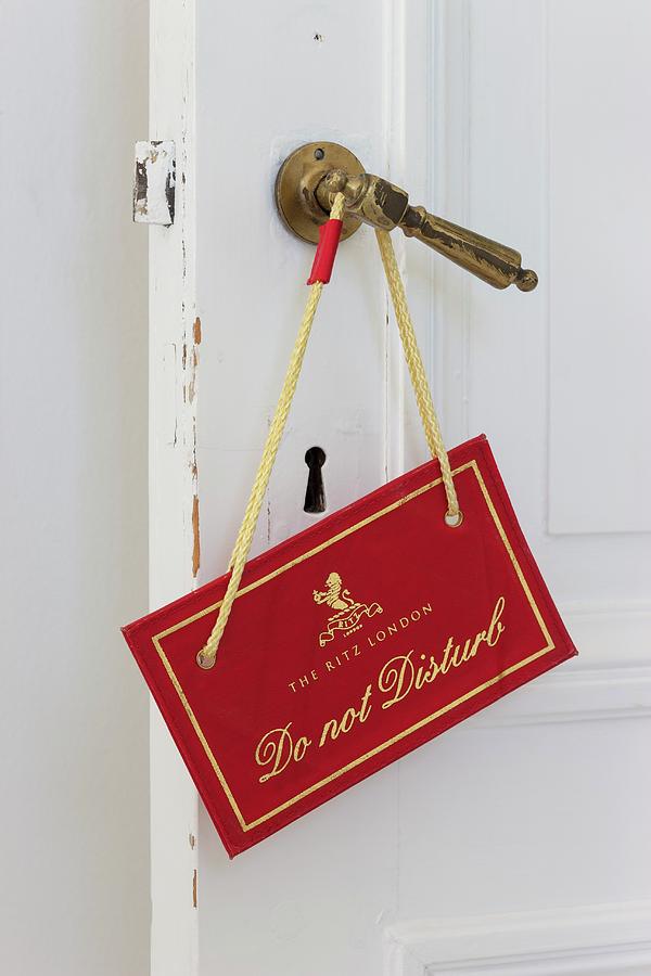do Not Disturb Sign On Traditional Brass Door Handle Photograph by Liesbet Goetschalckx