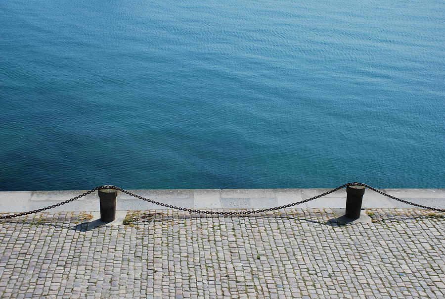 Dock Chain By Pavement Photograph by Photography By Kévin Niglaut