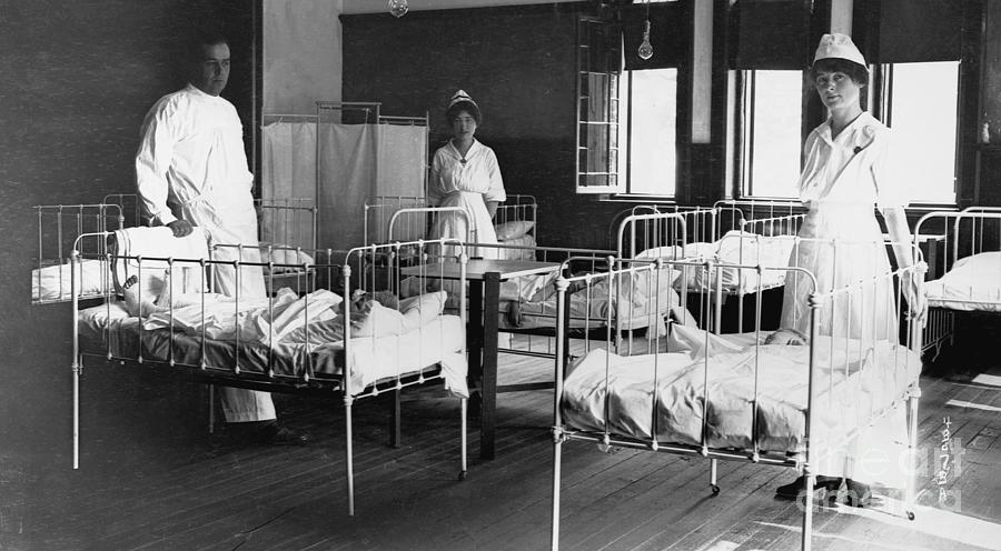 Doctor And Nurses With Infantile Photograph by Bettmann Doctor And Nurses With Infantile Photograph by Bettmann
