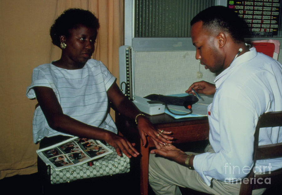 Doctor Examines Woman For Signs Of Arthritis Photograph by Sue Ford/science Photo Library