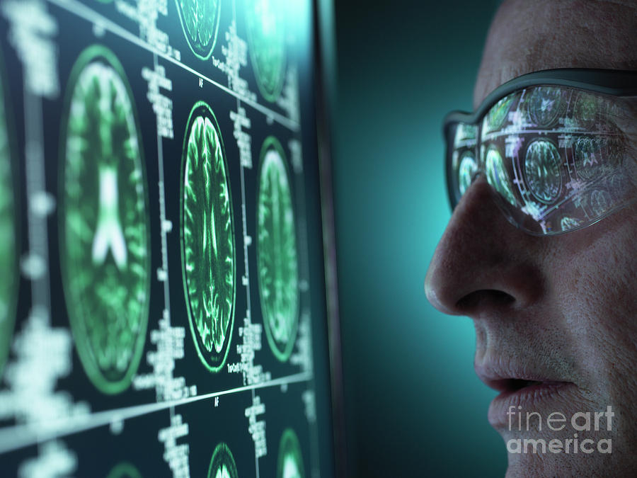 Doctor Examining Mri Brain Scans Photograph by Tek Image/science Photo Library