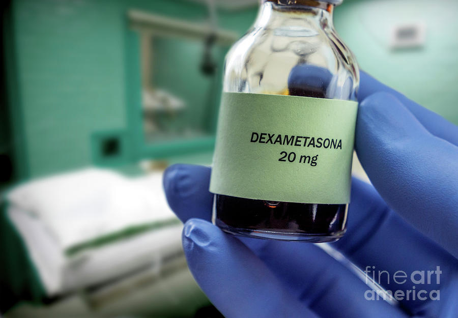 Doctor Holding Vial Of Dexamethasone In An Operating Theater Photograph by Digicomphoto/science Photo Library