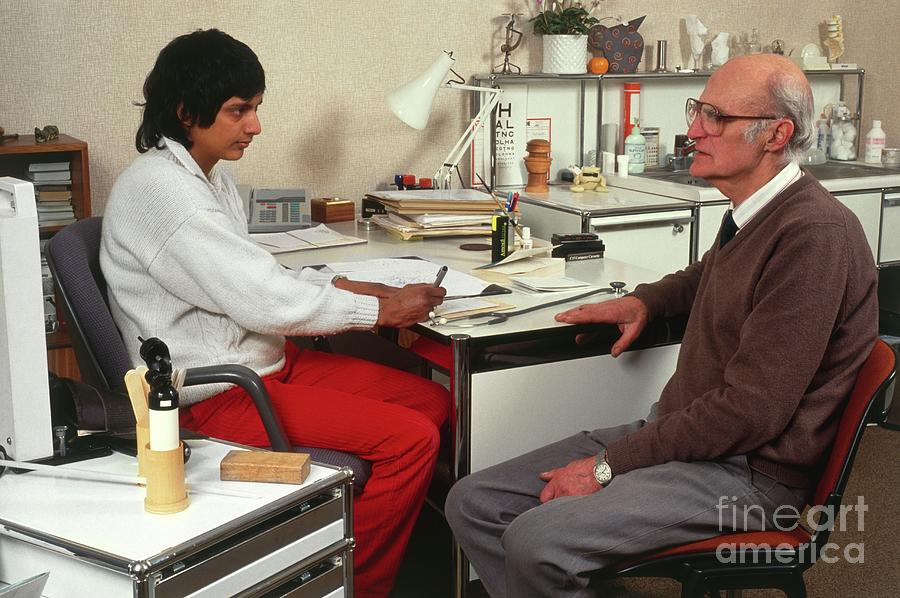 Doctor Writing A Prescription For An Elderly Man Photograph by Chris Priest & Mark Clarke/science Photo Library