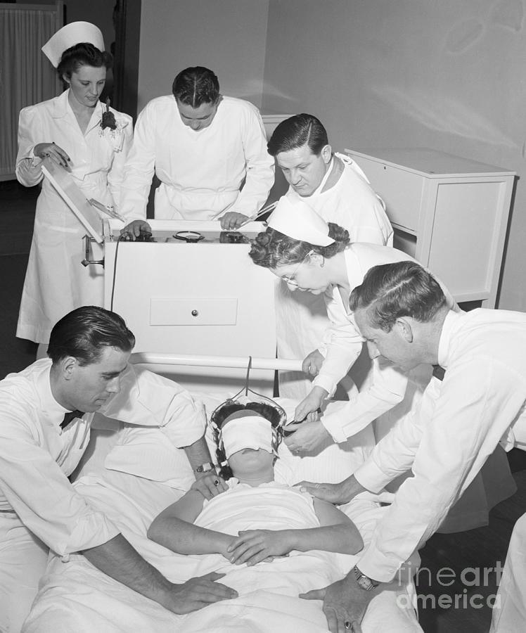 Doctors Administering Electroshock Photograph by Bettmann Doctors Administering Electroshock Photograph by Bettmann