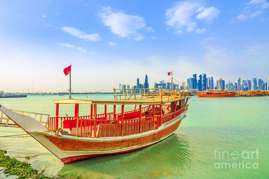 Doha skyline with dhow Photograph by Benny Marty
