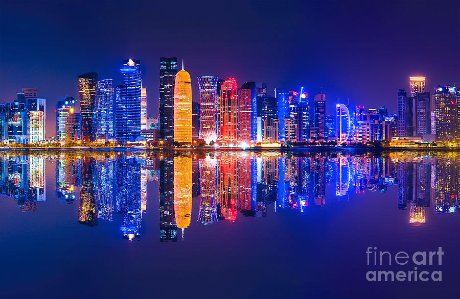 Doha skyscrapers reflecting night Photograph by Benny Marty