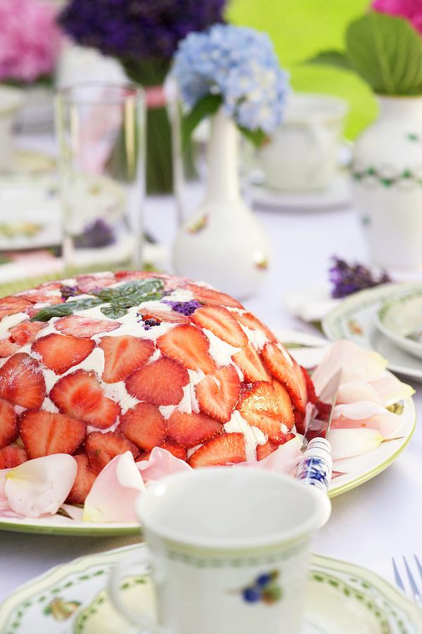 Domed Cake Decorated With Quark And Strawberries On Table Set For Afternoon Coffee Photograph by Rita Newman