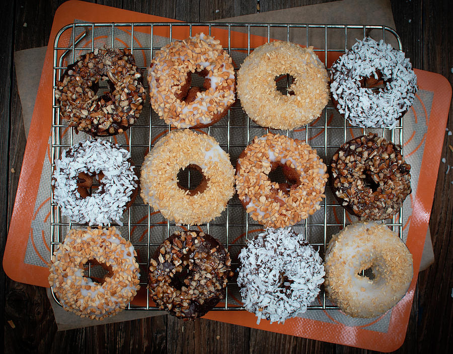 Donuts With Chopped Nutes, Powdered Sugar And Ganache Photograph by Adelina