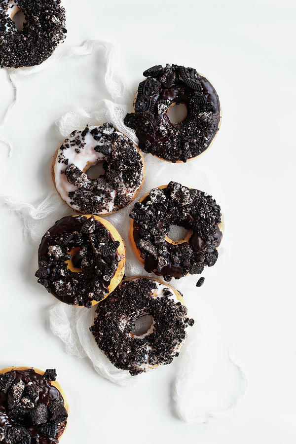 Donuts With Vanilla And Chocolate Icing And Oreo Cookie Crumbs Photograph by Stephanie Frey