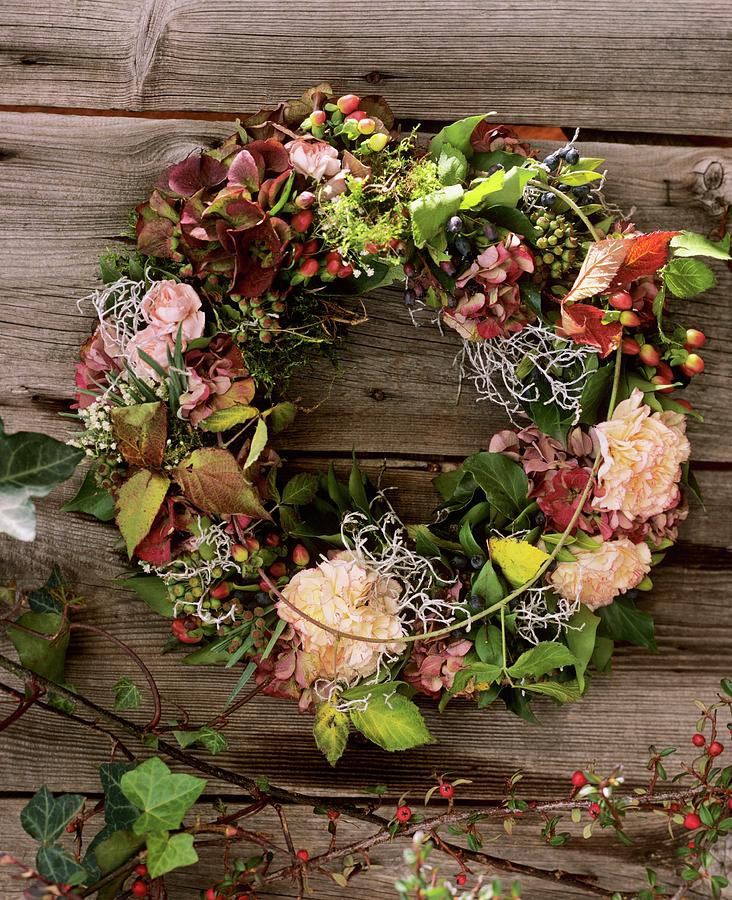 Door Wreath With Carnations And Blackberry Shoots Photograph by Friedrich Strauss