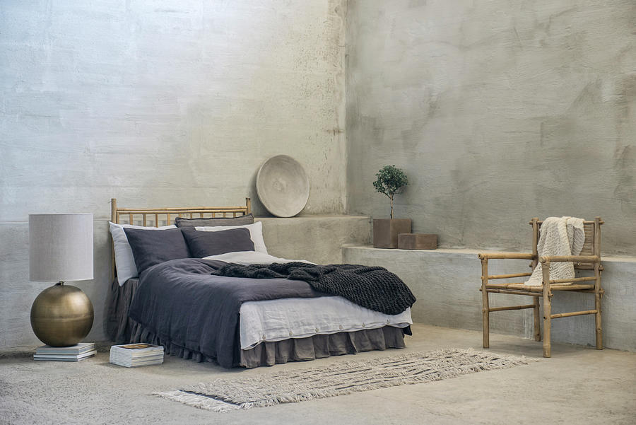 Double Bed, Bamboo Chair And Large Table Lamp On Floor In Room With Grey Walls Photograph by Magdalena Bjrnsdotter