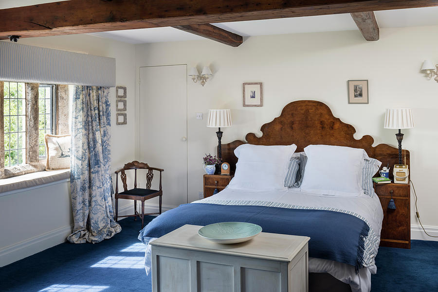 Double Bed With Antique Wooden Headboard In Blue And White Bedroom Photograph by Brian Harrison