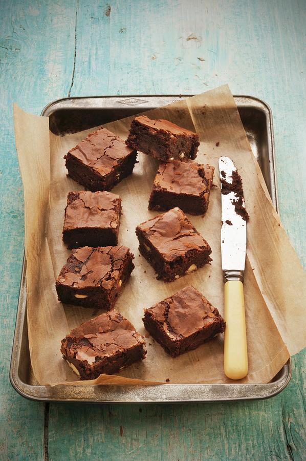 Double Chocolate Brownies On A Baking Tray With A Knife Photograph by John Hay