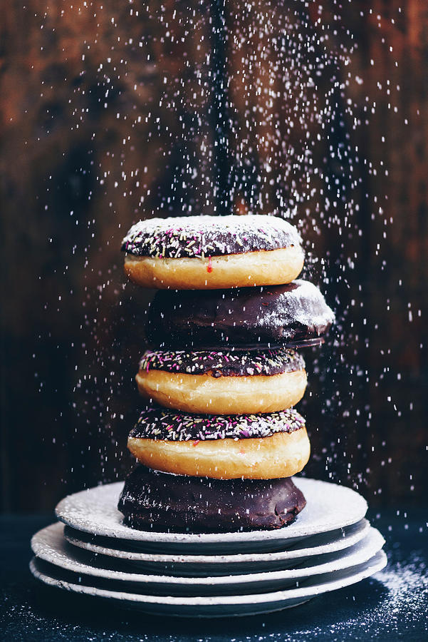 Doughnuts Being Sprinkled With Icing Sugar Photograph by Hein Van Tonder